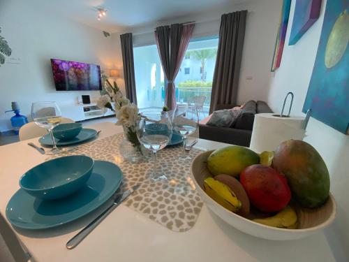 a kitchen with a bowl of fruit on a table at Apartment in Estrella, Dominicus-Bayahibe in La Laguna