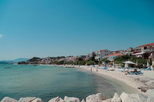 a beach with a bunch of people and the water at Elite estate in Podstrana