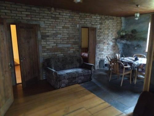 a living room with a couch and a table at ГРАНД in Szack