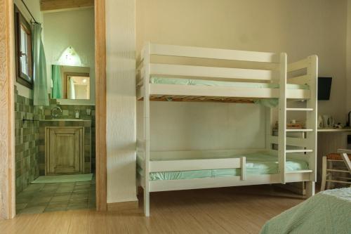 a room with a bunk bed and a bathroom at B&B Terra e Smeralda in Arzachena