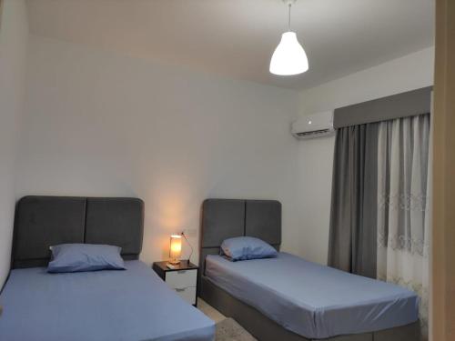 Ένα ή περισσότερα κρεβάτια σε δωμάτιο στο New Capital Celia apartment