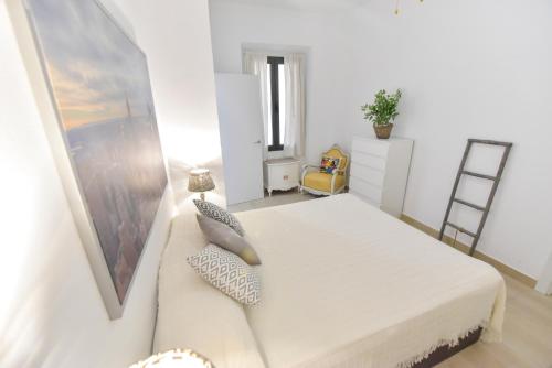 Ένα ή περισσότερα κρεβάτια σε δωμάτιο στο Apartamentos Gran Vía by SIERRA VIVA