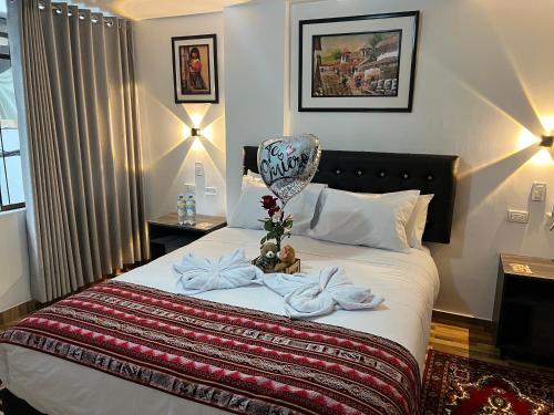 Ένα ή περισσότερα κρεβάτια σε δωμάτιο στο TAYWA HOTEL