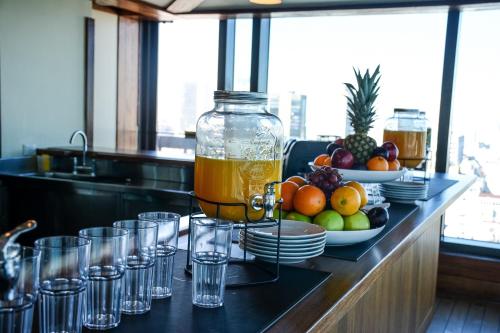 a table with glasses and a bottle of orange juice at Buenos Aires Marriott in Buenos Aires