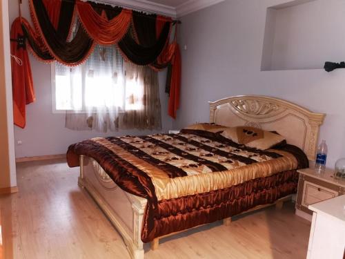 Postel nebo postele na pokoji v ubytování Apartment familial Tanger