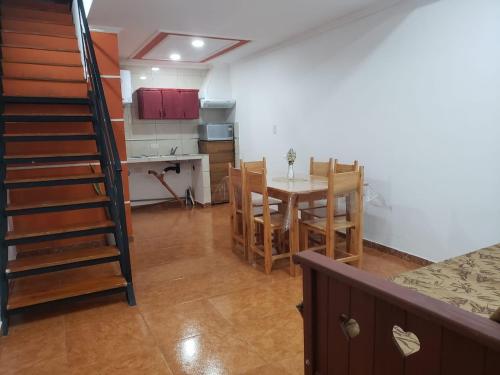 a kitchen and dining room with a table and chairs at DEPARTAMENTO CENTRICO in Oberá
