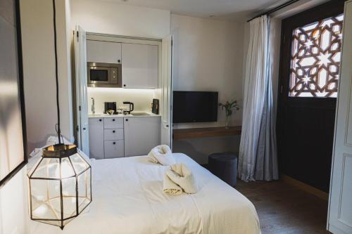 Katil atau katil-katil dalam bilik di La Ermita Suites - Único Hotel Monumento de Córdoba