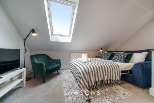 a bedroom with a bed and a tv and a chair at Windsor 1BR Gem with Free Parking in Windsor