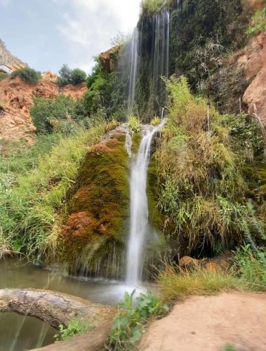 a waterfall on the side of a mountain at CASA RURAL CELIA con Escape Room in Ayna