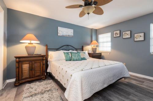 a bedroom with a bed and a ceiling fan at 2402 Ocean Pointe in Tavernier