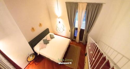 a small room with a bed and a window at Apulia Journey - Manzoni 11 in Bari