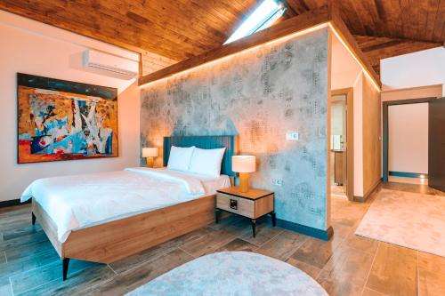 A bed or beds in a room at Kartal Konağı