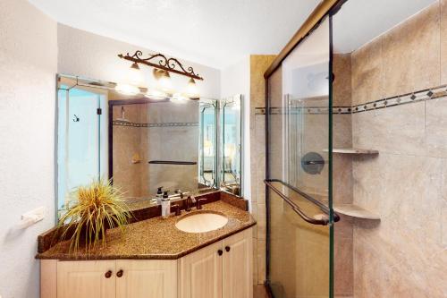 a bathroom with a sink and a shower at Lighthouse Towers #206 in Clearwater Beach
