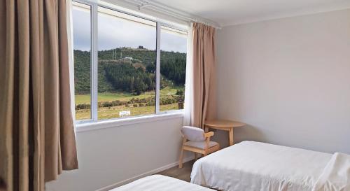 Postel nebo postele na pokoji v ubytování AWA Hotel