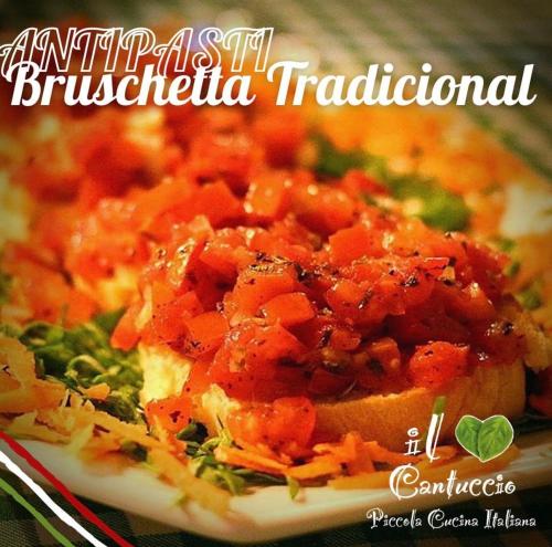 a plate of food with carrots and broccoli at Pousada Bar Café Algas Marinhas in Praia do Forte