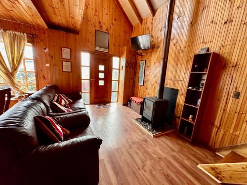 TV a/nebo společenská místnost v ubytování CABAÑA 325 centro de QUELLON