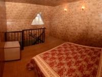 a bedroom with a bed and a window in it at Guest House Fairy Tale in Kaji-Say