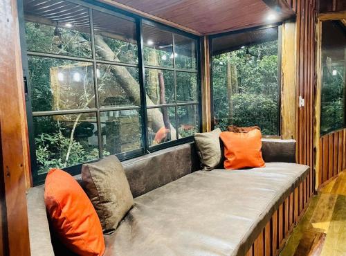 a large window seat in a tree house at Cabañas La Montaña in Monteverde Costa Rica