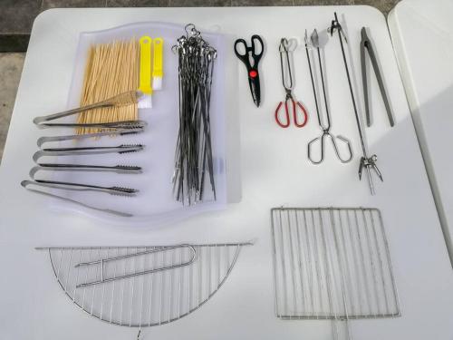 a group of scissors and other tools on a table at The 29 Bungalow Setapak KL by Manhattan Group in Kuala Lumpur