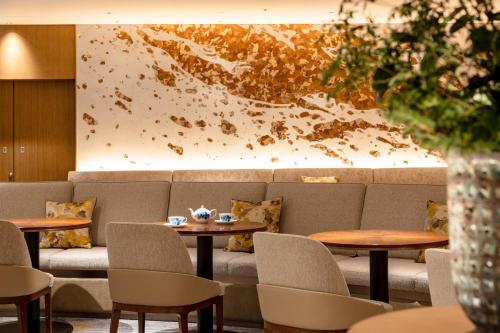 a waiting room with tables and a couch at The Westin Miyako Kyoto in Kyoto
