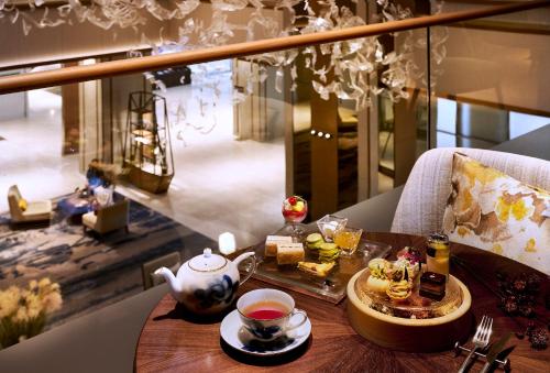 a table with a tea set on top of it at The Westin Miyako Kyoto in Kyoto