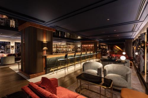 a bar at a hotel with chairs and tables at The Westin Miyako Kyoto in Kyoto