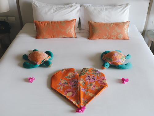 Postel nebo postele na pokoji v ubytování Proud Phuket, Naiyang Beach