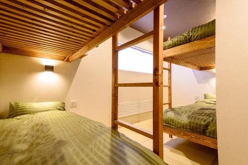 A bed or beds in a room at Iroha Nozawa