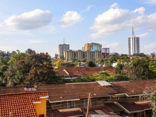 a view of the city from the roofs of houses at Stunning 1-Bedroom Apartment in Madaraka Estate, Nairobi in Nairobi