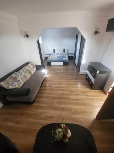 a room with two beds and a table in it at Vila Dana in Costinesti