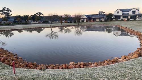 a pond of water with rocks around it at Robertson Halfway House in Robertson