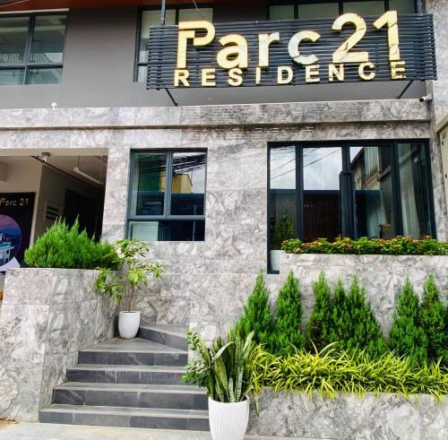 a facade of a building with stairs and plants at Parc21 Luxury Boutique Hotel in Phnom Penh