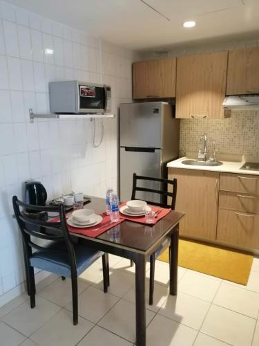 Dapur atau dapur kecil di Kuwait Residence