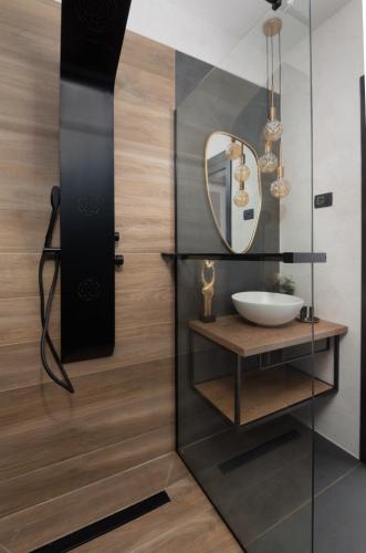 a bathroom with a sink and a mirror at Soho in Punta