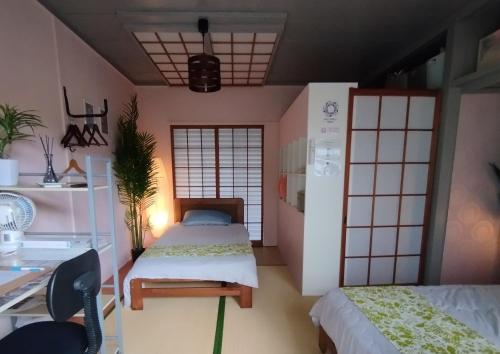Green Flamingo Hostel tesisinde bir odada yatak veya yataklar