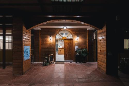 an entrance to a building with a wooden door at Yushow Library Villa in Nanzhuang