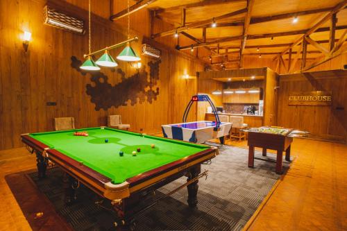 a billiard room with a pool table in it at Skyview by Empyrean in Patnitop