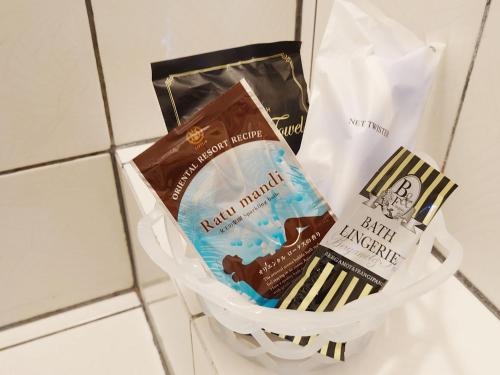a basket of chocolate and a bag of toothpaste at Restay Nagasaki Aine (Adult Only) in Nagasaki