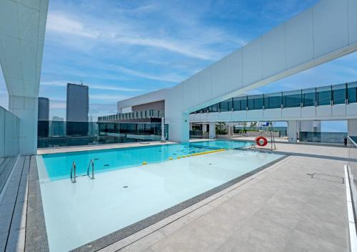 a swimming pool on the roof of a building at Ultra Luxury Wasl 1 Residences Zabeel Park in Dubai