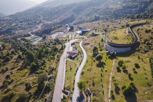 an aerial view of a road in a valley at Skyview by Empyrean in Patnitop