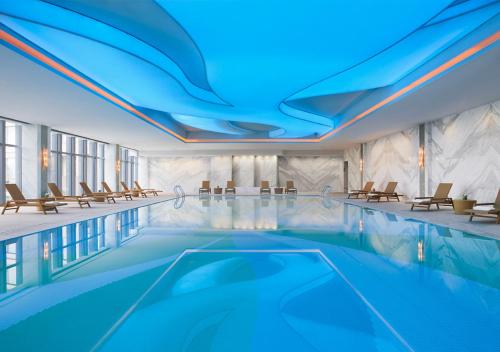 a rendering of a swimming pool in a hotel at Courtyard by Marriott Hangzhou Wulin in Hangzhou