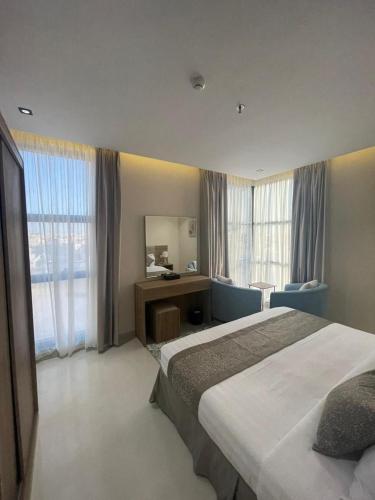 Una cama o camas en una habitación de HIGH VIEW HOTEL فندق عالية الاطلالة