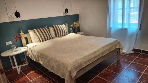 Postel nebo postele na pokoji v ubytování Vila Milenovic Rajacke Pivnice