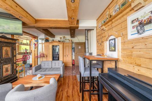 a living room with a couch and a table at Panoramahotel Stocker in Pruggern