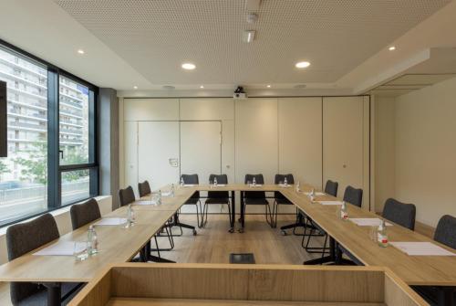 a large conference room with a long table and chairs at Crowne Plaza - Marseille Le Dôme in Marseille