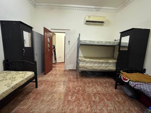 a room with two bunk beds and a hallway at Bed Space for Female single and bunk bed Al Sayed Builidng - Sharaf DG Exit 4 Flat 301 in Dubai
