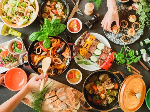 a table with many plates of food on it at GLAMP ELEMENT(グランエレメント） in Maibara