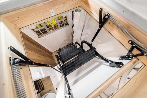 an overhead view of a chair in a tiny house at Micro Apartments 2,5 qm - Najmniejsze Apartamenty Świata 2,5 mkw in Krakow