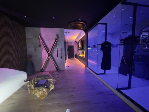 a display case in a store with a dress on display at Les Secrets Rooms - Bonneval - Love Room - Spa et Hammam Privatif in Bonneval