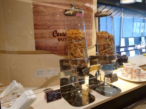 a counter with a display of different types of food at Wakayama Urban Hotel in Wakayama